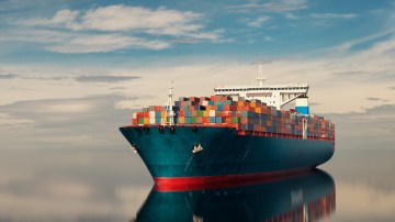 The header image shows a cargo ship in the water.