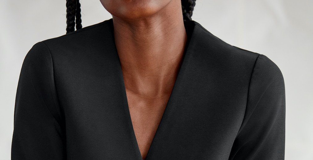 The header features a person's neckline.