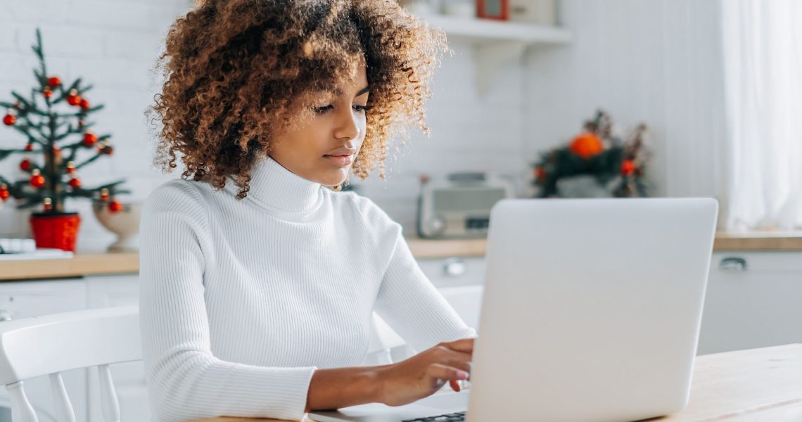 The lead image shows a woman working on a laptop.