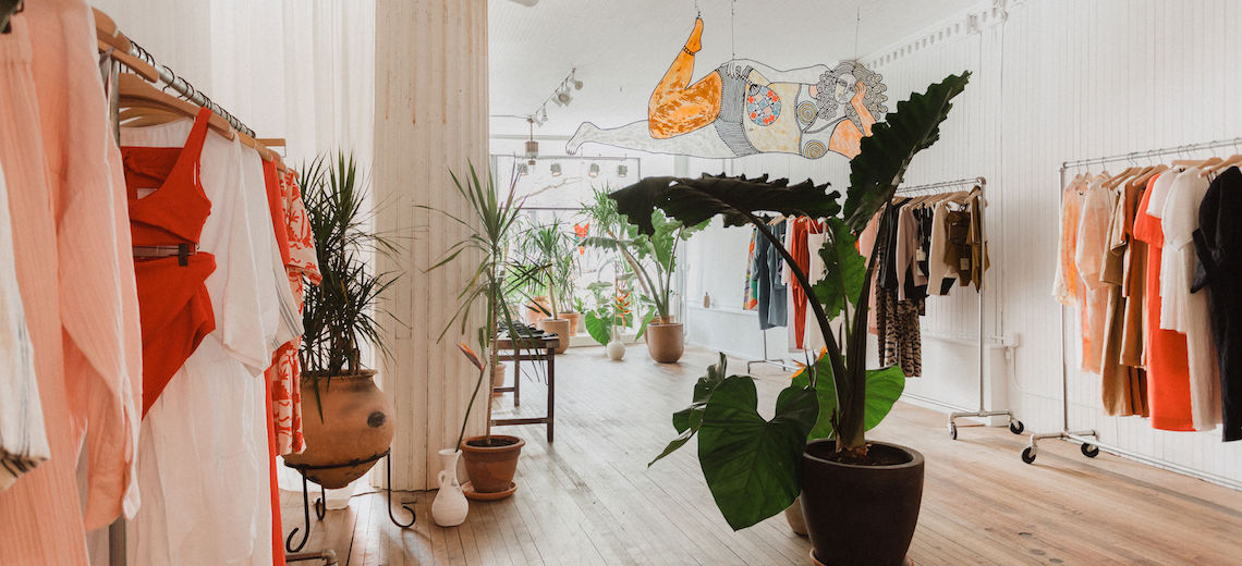 The header image features the inside of a fashion boutique.