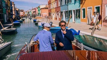 The header image shows two men in a boat.