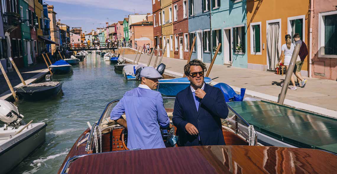 The header image shows two men in a boat.