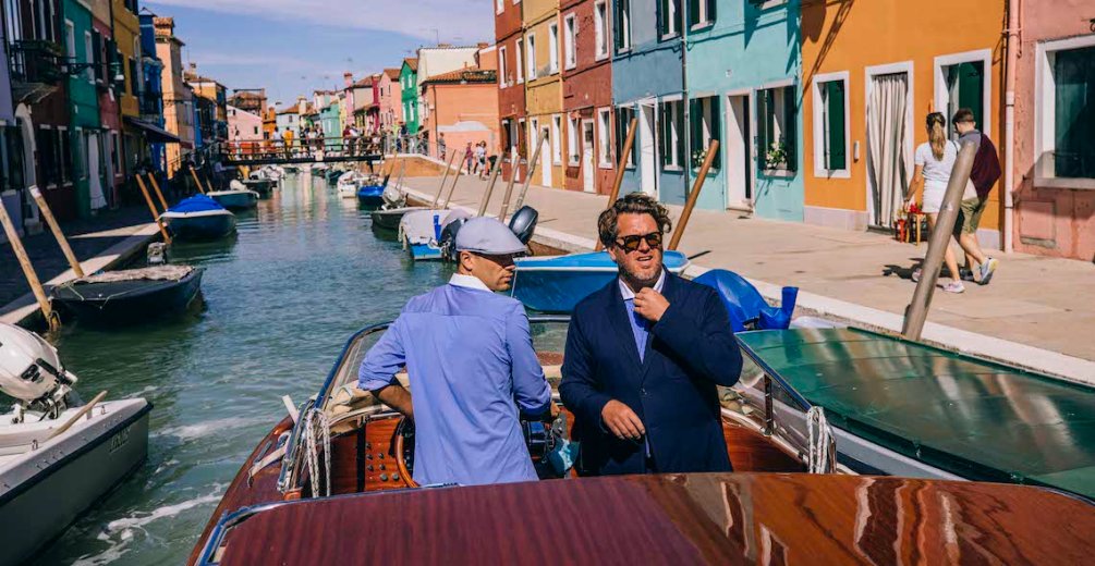 The header image shows two men in a boat.