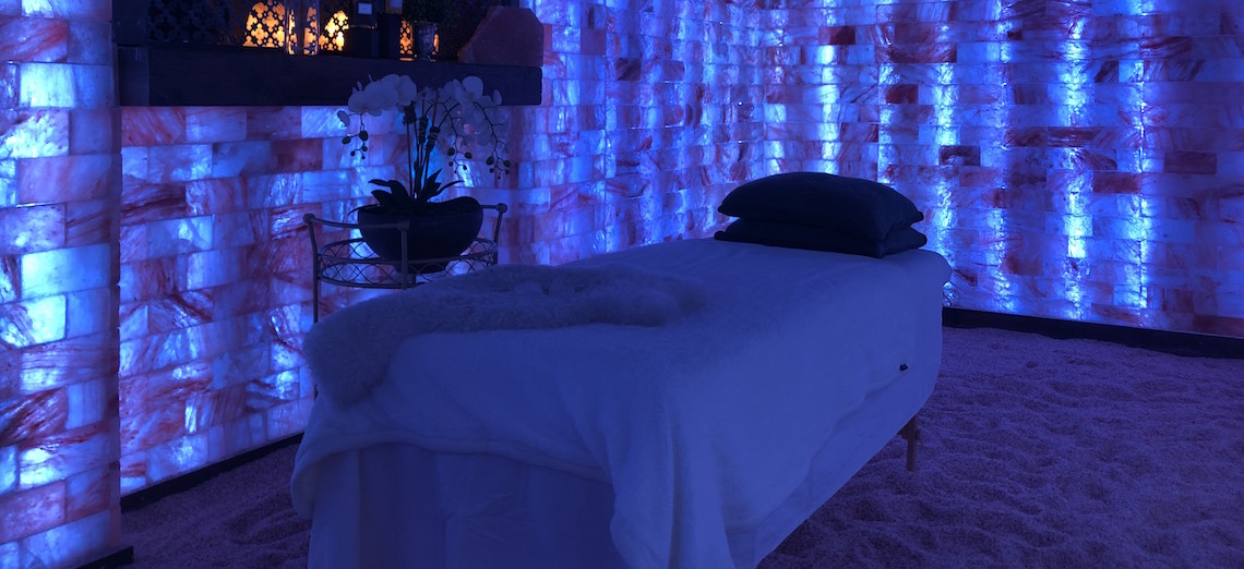 The lead image shows a photograph of a massage table.