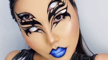 Photograph of woman with intricate face makeup.
