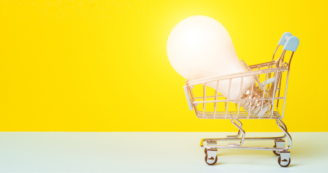 picture of a shopping cart with a bright, oversized lightbulb shining inside.