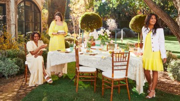 Draper James items set outside in a yellow and white picnic