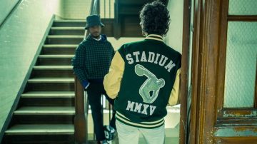 Photo of Stadium Goods jacket on guy in front of stairs