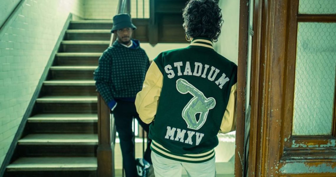 Photo of Stadium Goods jacket on guy in front of stairs