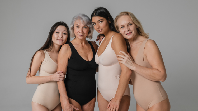 four women of different ages wearing shapewear. representing shapewear brand breaking through the noise with marketing.